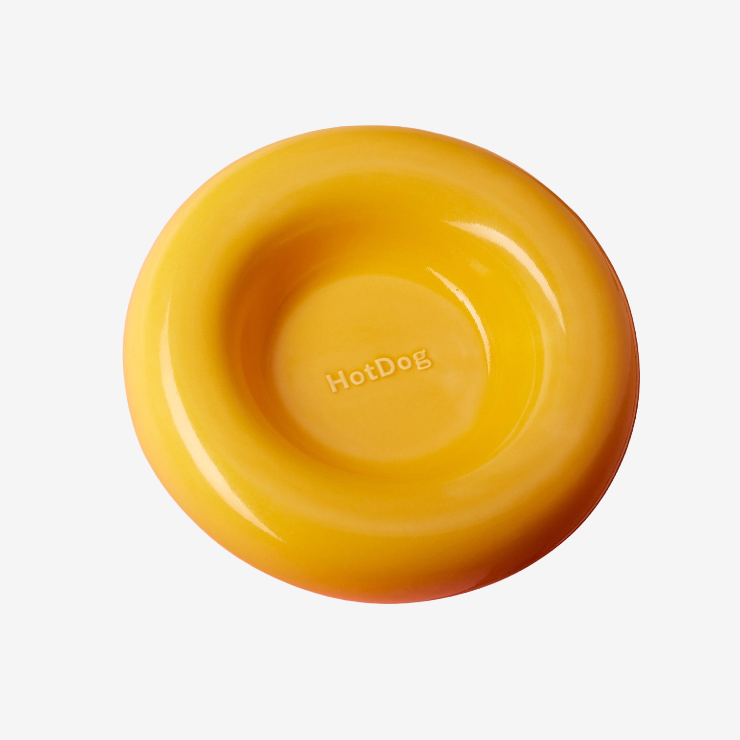 Yellow ceramic curved dog bowl with 'HotDog' branding on a white background