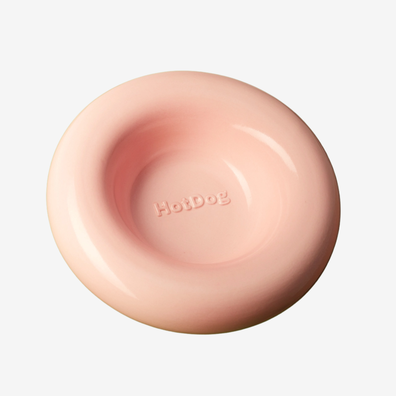 Pink dog bowl with 'HotDog' branding on a white background