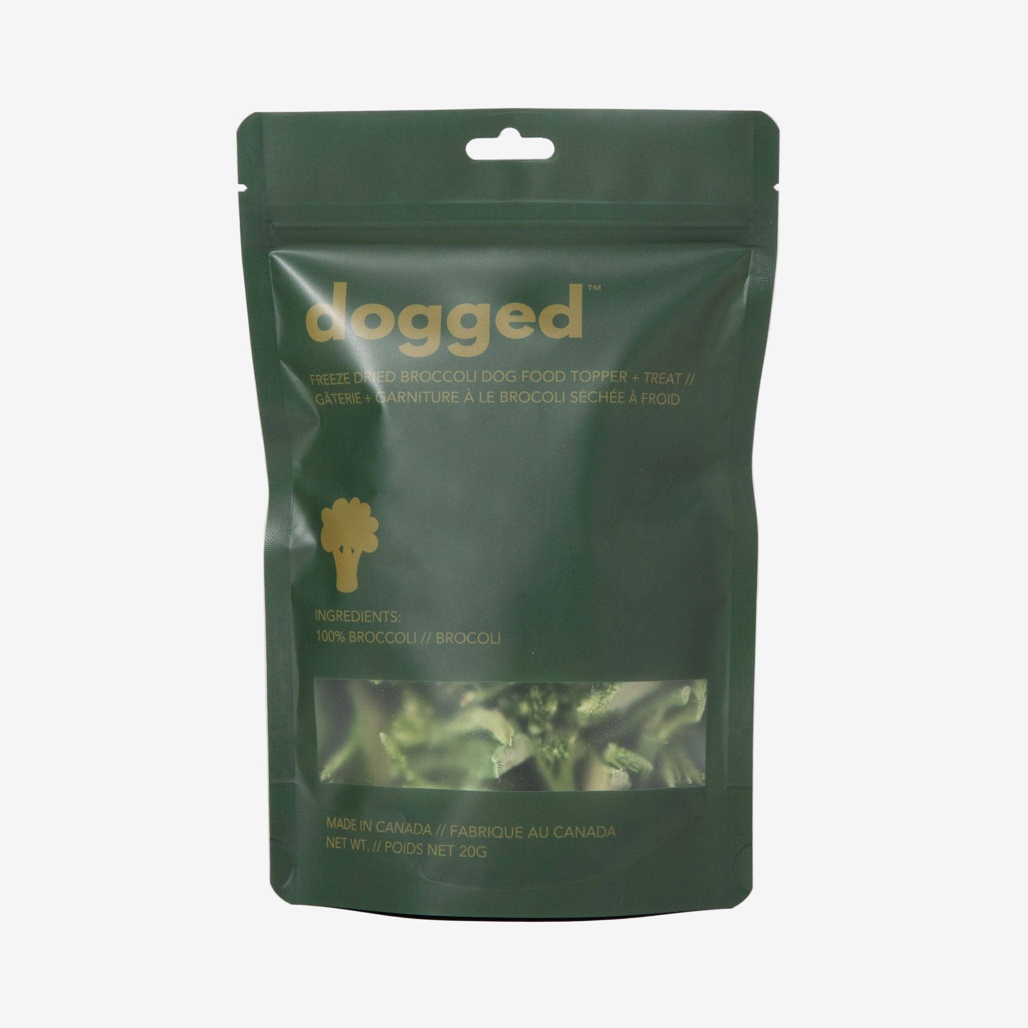 Green package of 'dogged' food with visible branding and product details on a light gray background