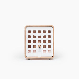 Square wooden dog crate with grid design on a white background