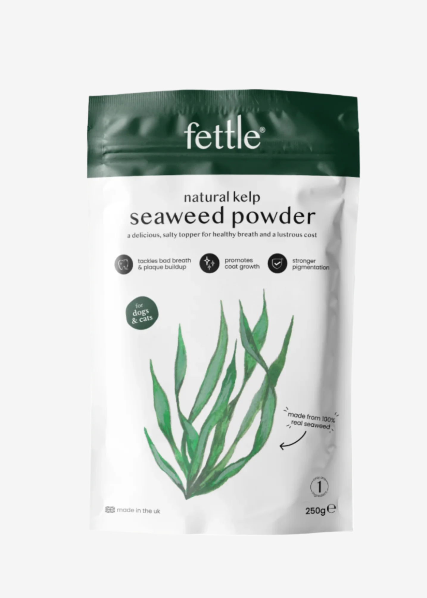 A bag of Fettle natural kelp seaweed powder with a green plant illustration, next to a small bowl of the powder.