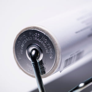 Close-up of a metal lock mechanism with branding and text on a white background