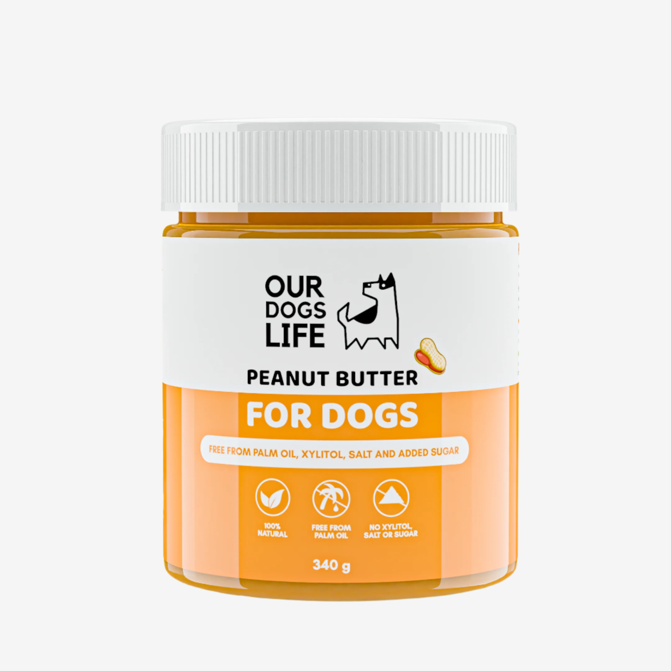 A jar of peanut butter for dogs, labeled "Our Dogs Life," highlighting it's 100% natural and free from harmful ingredients.