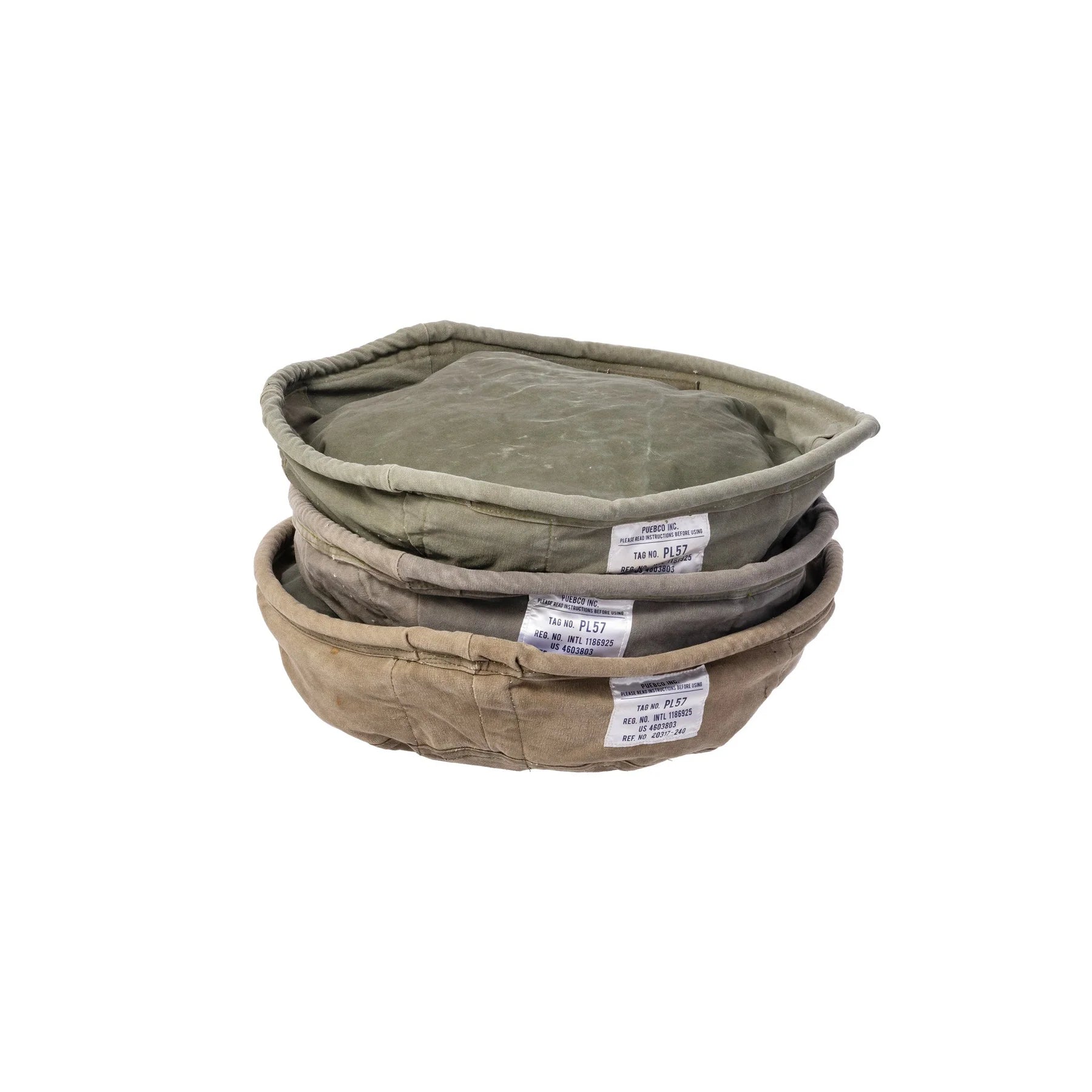 Stack of three green fabric baskets with labels on a white background