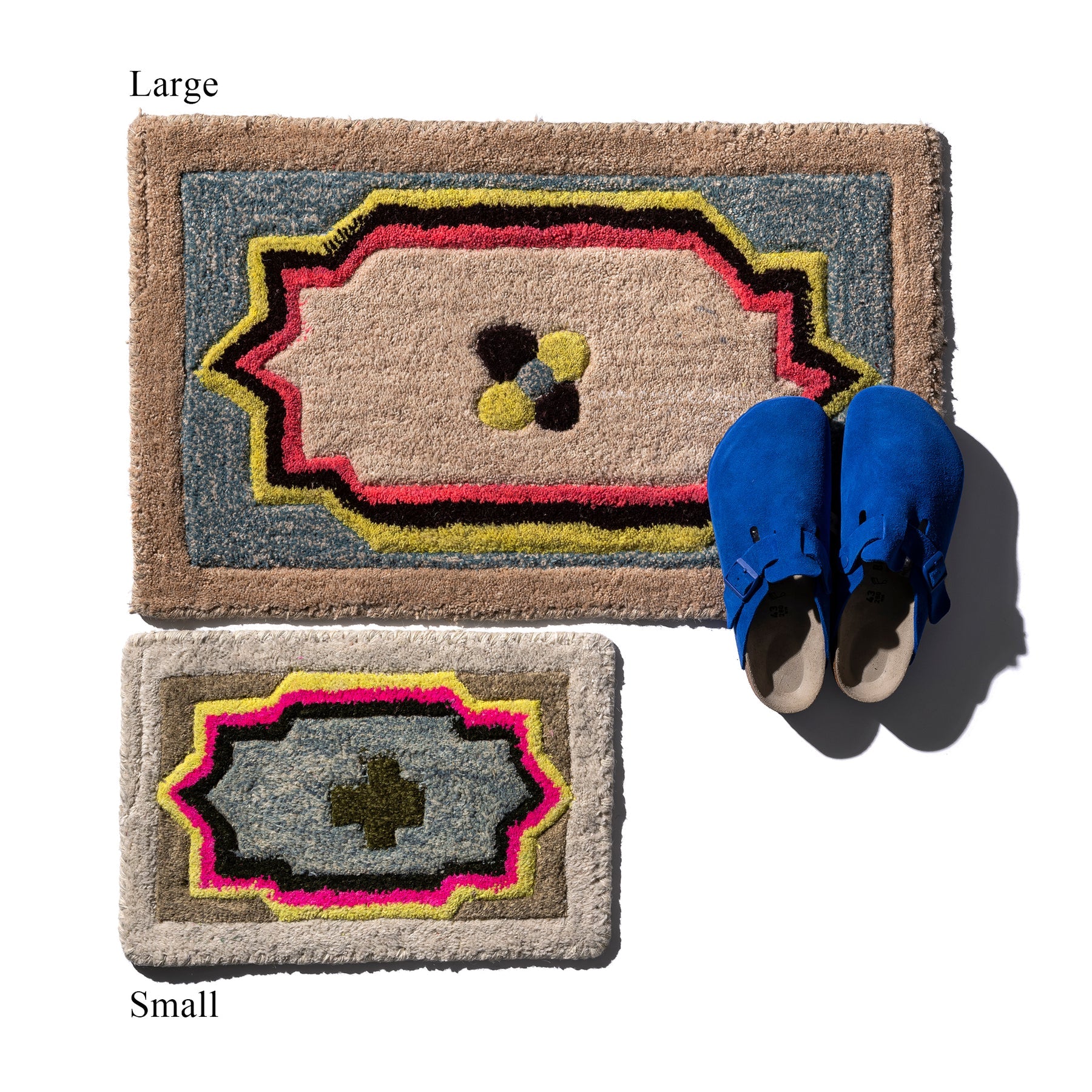 Two decorative mats, one large and one small, with a pair of blue shoes on top.