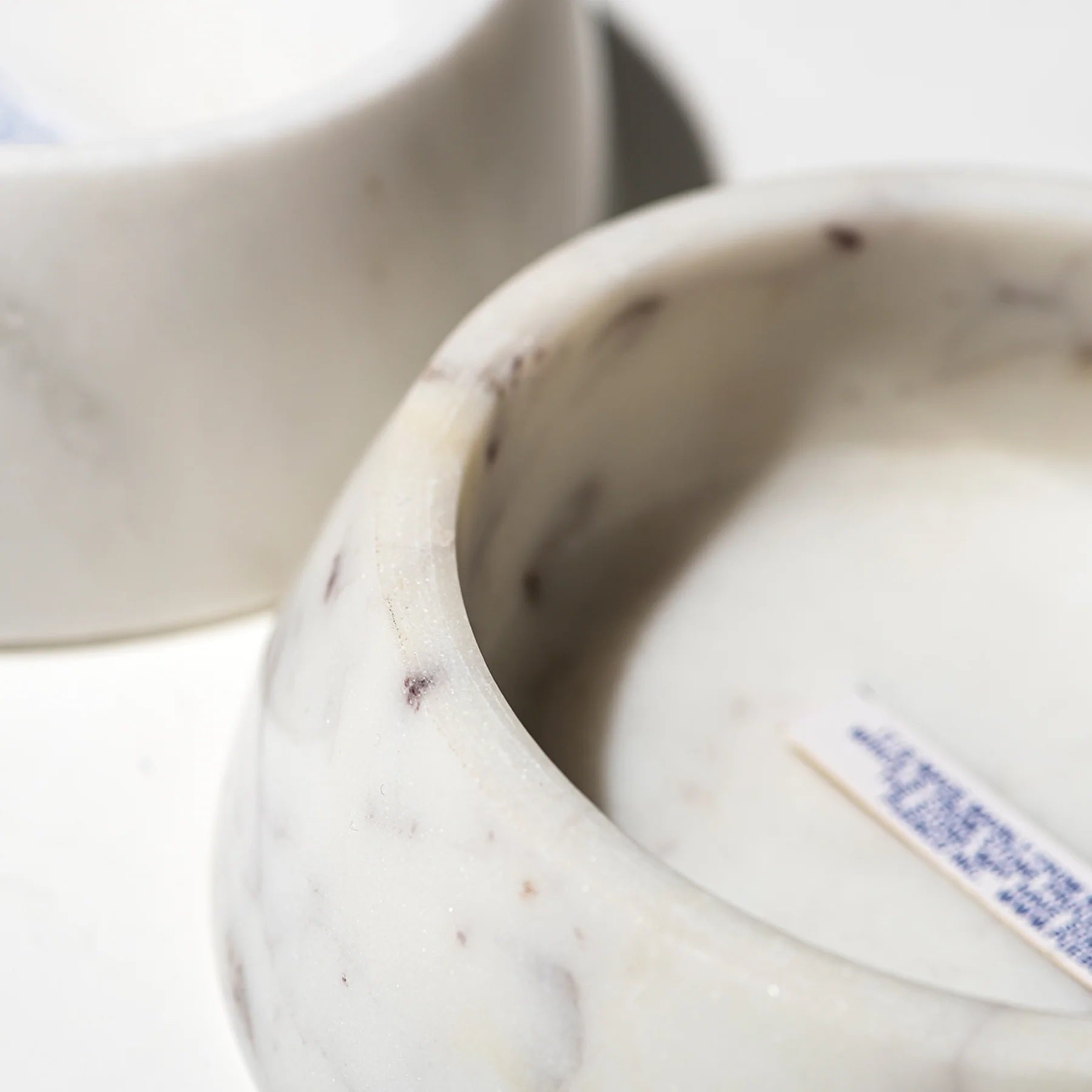 Close-up of a marble bowl with a blurred background