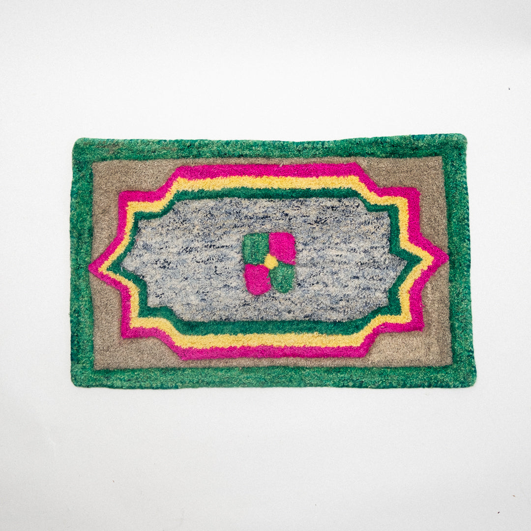 Decorative doormat with colorful border on a white background