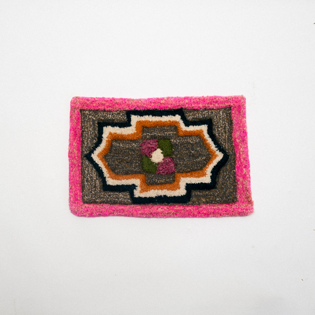 Rectangular rug with a geometric pattern on a white background