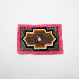 Rectangular rug with a geometric pattern on a white background