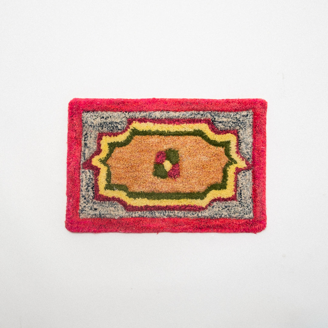 Decorative doormat with a colorful design on a white background