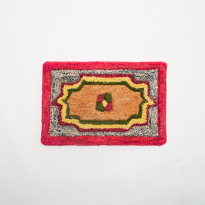 Decorative doormat with a colorful design on a white background