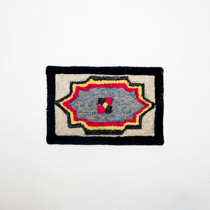 Decorative rug with geometric pattern on a white background