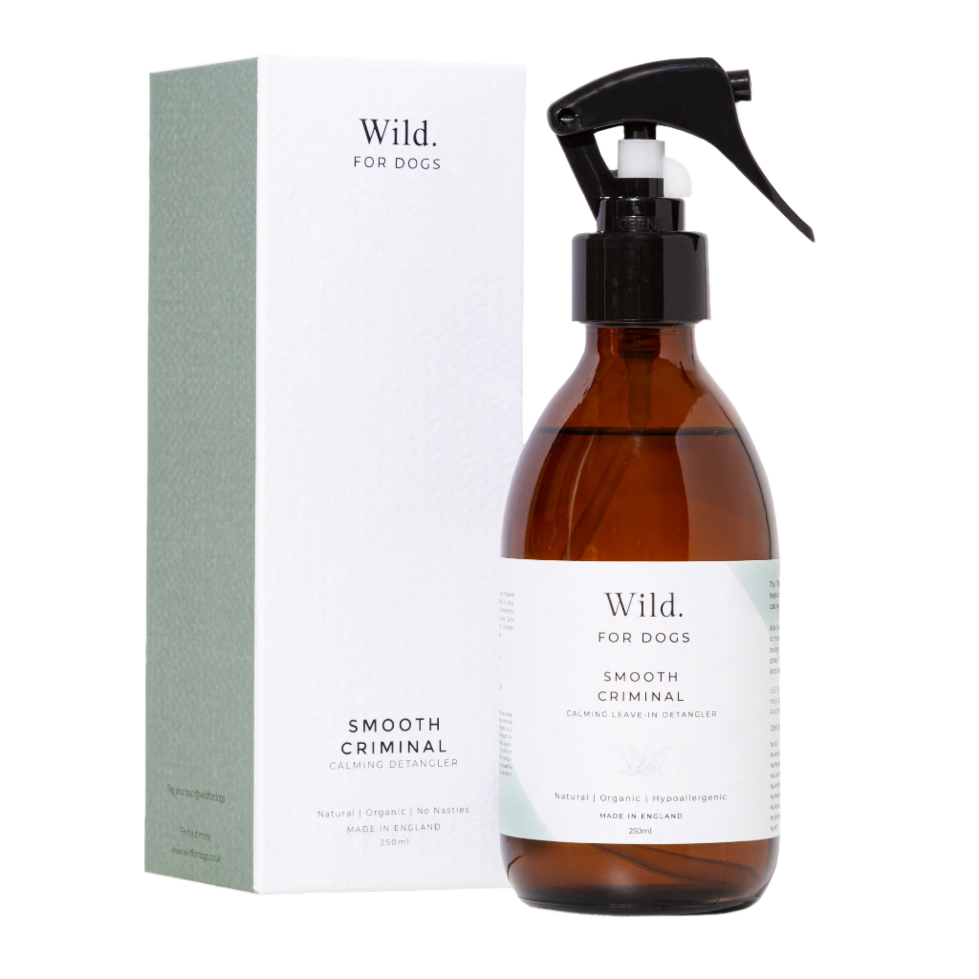 Calming Detangler spray by Wild for Dogs in a glass bottle, next to the box. All natural and vegan.