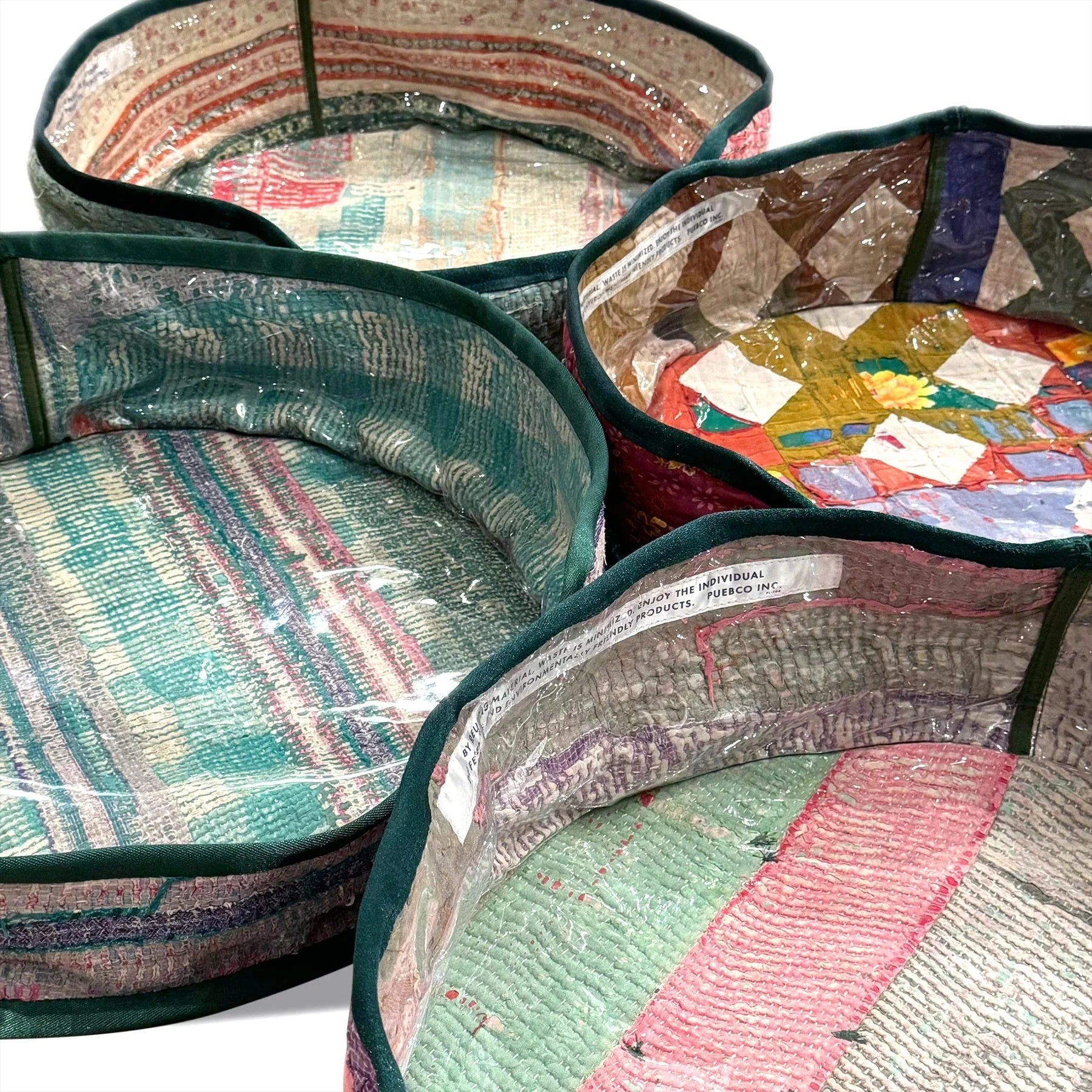 Colorful fabric bowls with intricate patterns on a white background