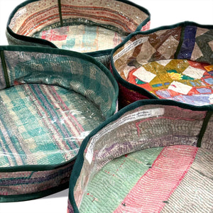 Colorful fabric bowls with intricate patterns on a white background