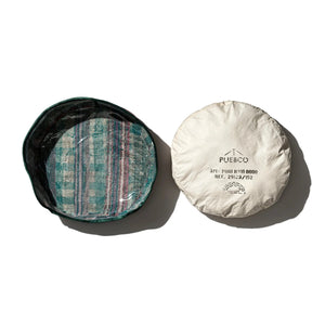 Two round containers, one striped and one plain white, on a white background with 'PUEBCO' branding.